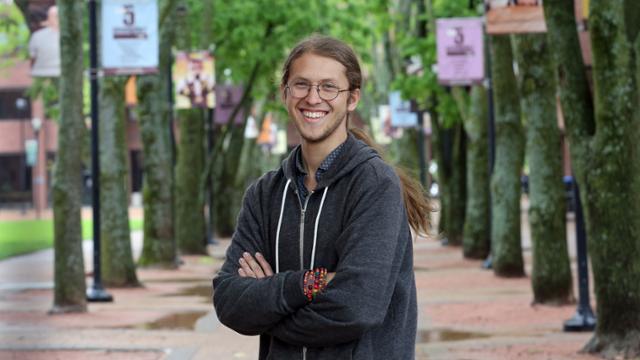 Graham Murphy under the trees in Fountain Square