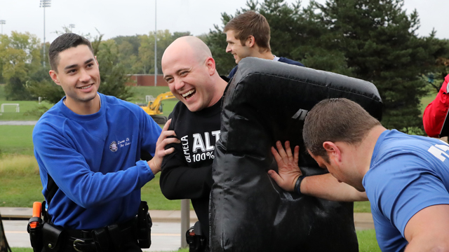 Police academy recruits during riot training