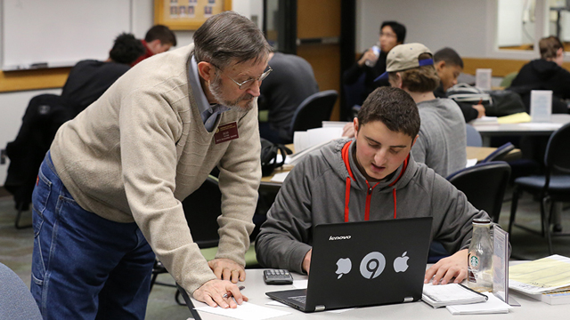 Tutor helping a student in one of the resource centers