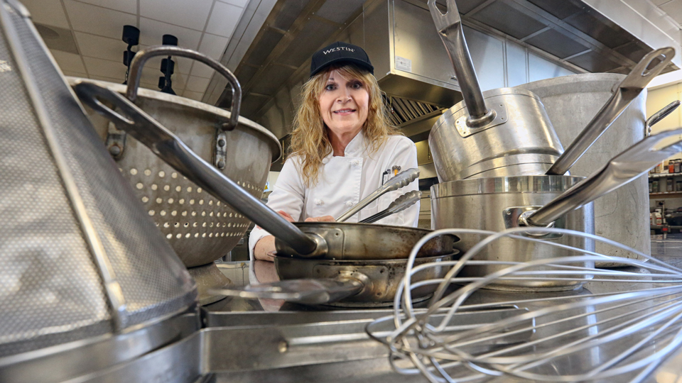 Janelle Domoney surrounded by kitchen tools