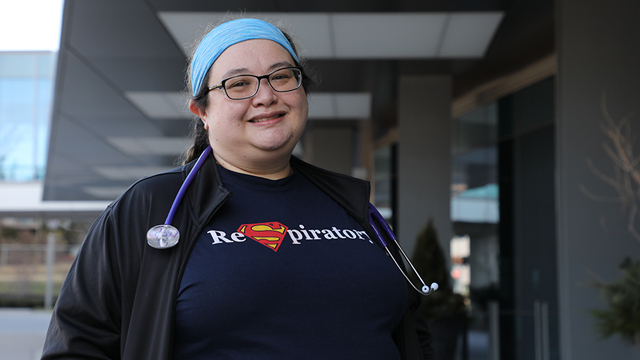 Stephanie Ghilino standing outside a hospital wearing a stethoscope