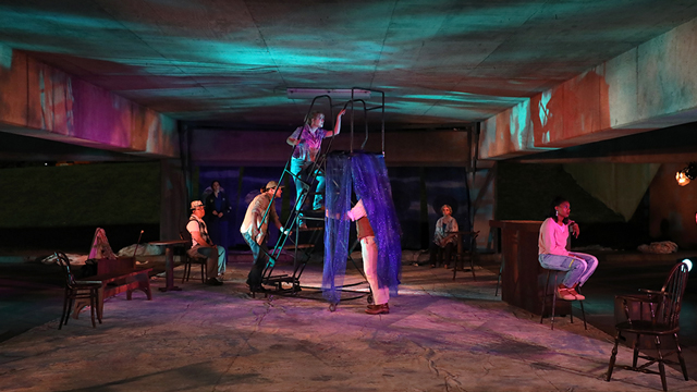 Seven theatre students perform in parking garage