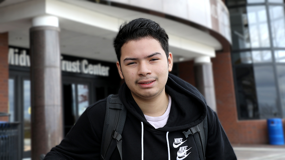 Willie Solano standing at the entrance to the Midwest Trust Center