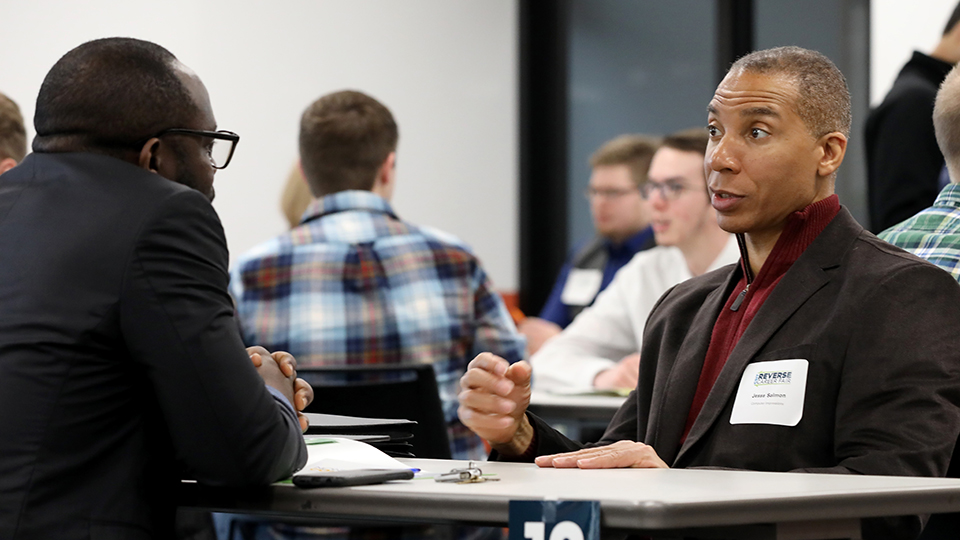 Jesse Salmon consulting with a student