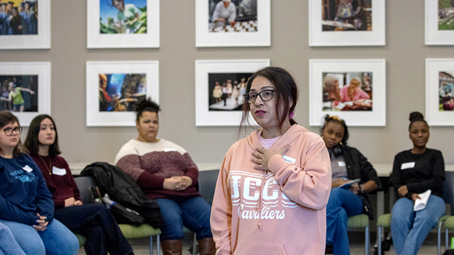 Student addressing a group of other students