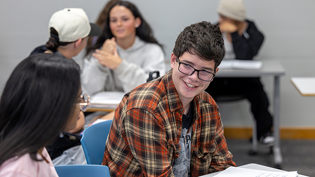 Students cheerfully chatting in a classroom