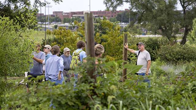 Students during a class held outdoors in the food forest portion of the Stu Shafer Open Petal Farm.