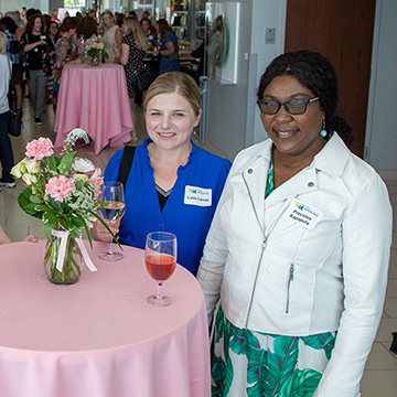 four women smile at the viewer