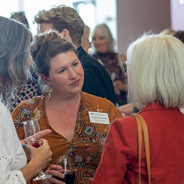 three women chatting at the 2024 JCCC Summer Sips and Scholarships event