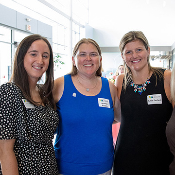 a group of four smiling women
