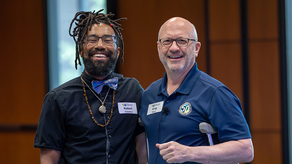 Greg Musil, right, and Robert Freeman at a JCCC Foundation event.