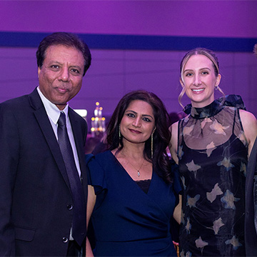 four people pose for a picture at the 2025 Some Enchanted Evening Gala