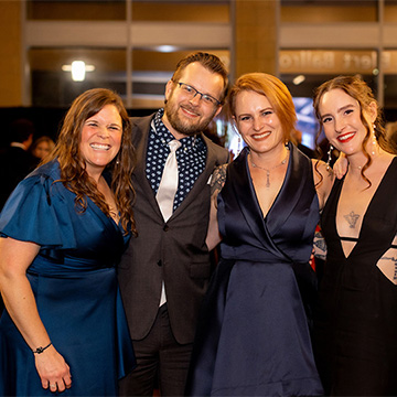 a group of people pose for a picture at the 2025 Some Enchanted Evening Gala