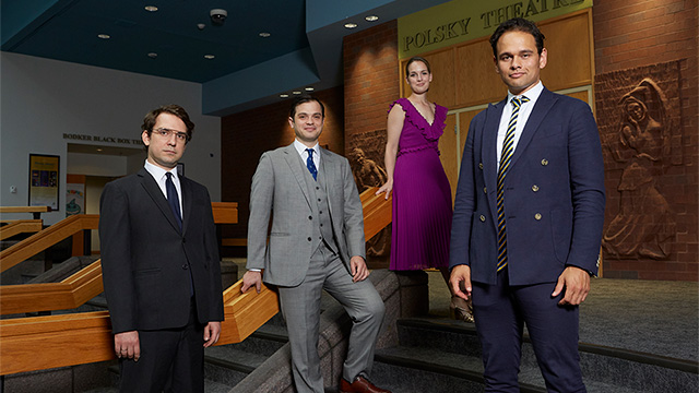 The members of Opus 76 standing in front of the Polsky Theatre.