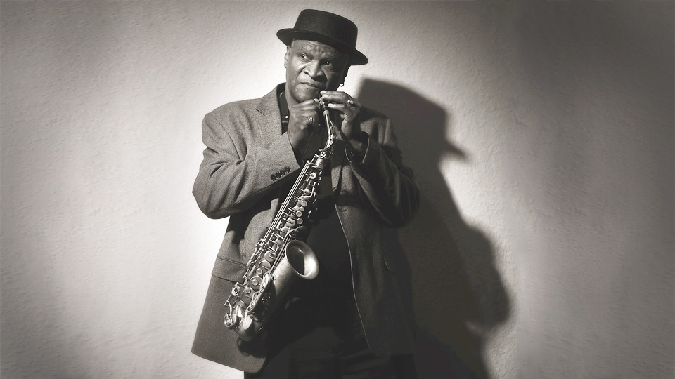 Bobby Watson holding a saxophone