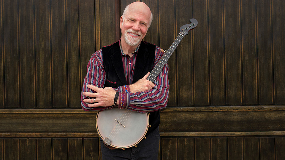 John McCutcheon holding a banjo