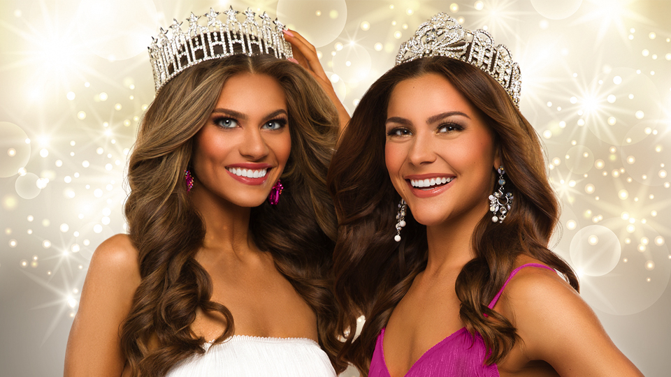 two smiling beauty queens wearing tiaras and formal dress