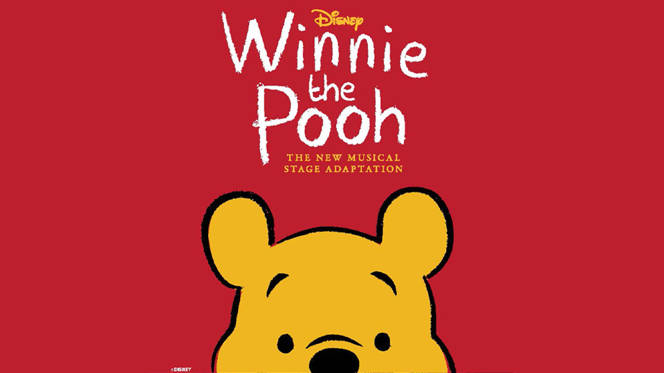 Winnie the Pooh popping up from the bottom of the image