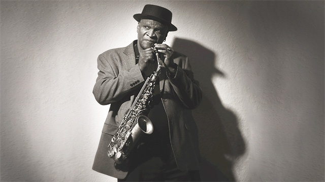 Bobby Watson holding a saxophone