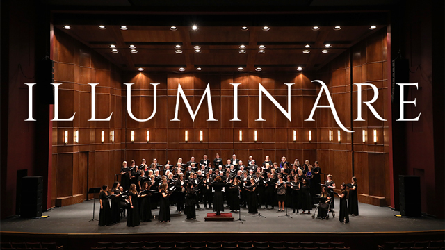 The JCCC Chorus performing on stage with the word Illuminare superimposed above them
