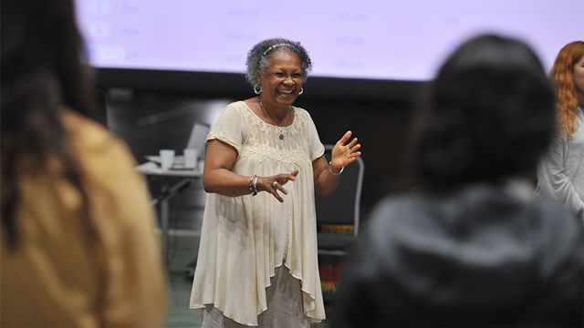 a workshop leader demonstrates a jazz technique