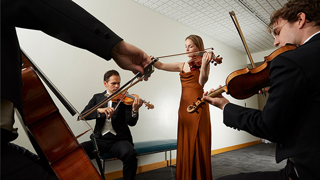 the 4 members of Opus 76 playing their instruments