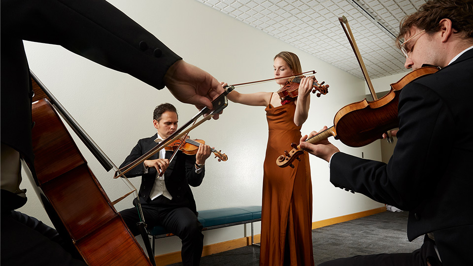 the 4 members of Opus 76 playing their instruments