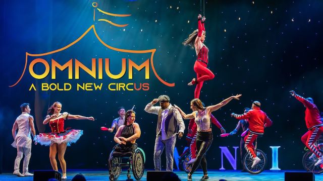 circus performers pose on stage with the words Omnium A Bold New Circus