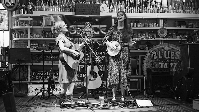 Beth Watts Nelson and Kelly Hunt performing on stage