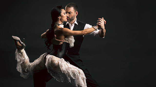 two dancers performing a tango