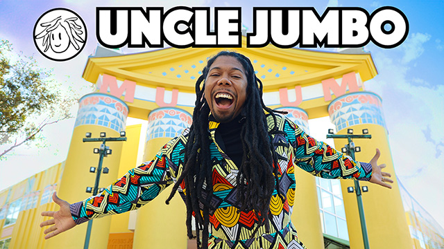 uncle jumbo smiles with his arts outstretched