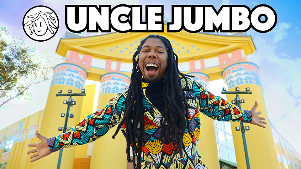 uncle jumbo smiles with his arts outstretched