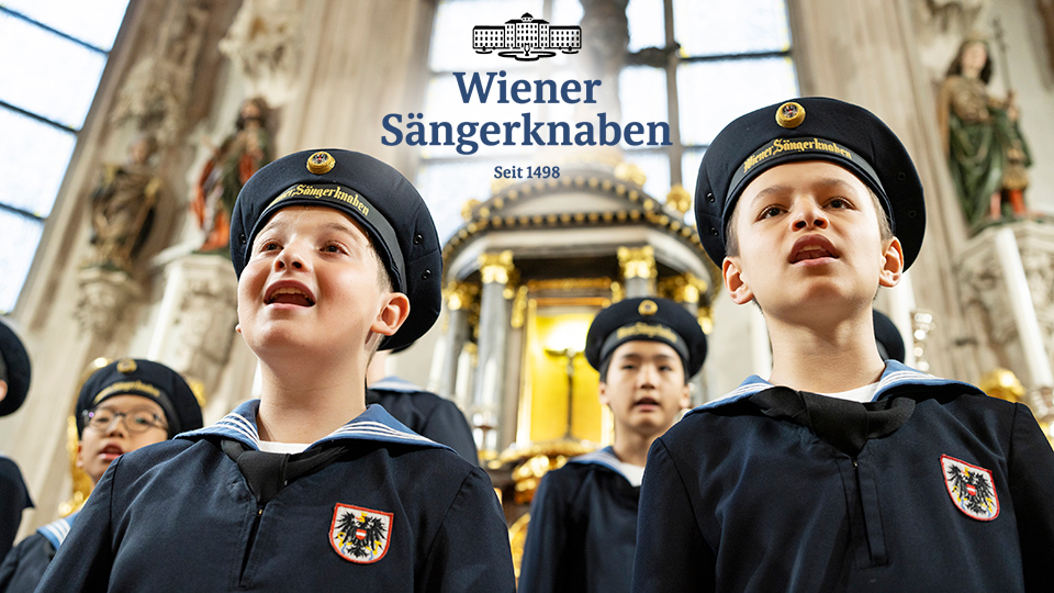 a choir of young boys singing in a church