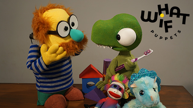 puppets of a man in a striped shirt and a t-rex holding a toothbrush