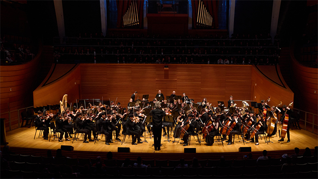 The youth symphony of Kansas City performing on a stage