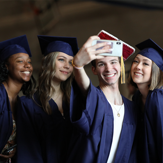 A group of graduates taking a selfie
