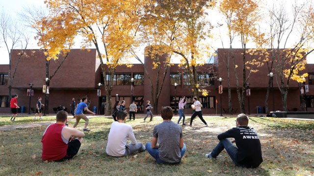 Students playing Frisbee in Fountain Square