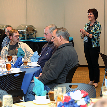 Kena Zumalt, Program Director, Veteran Services, addresses luncheon attendees