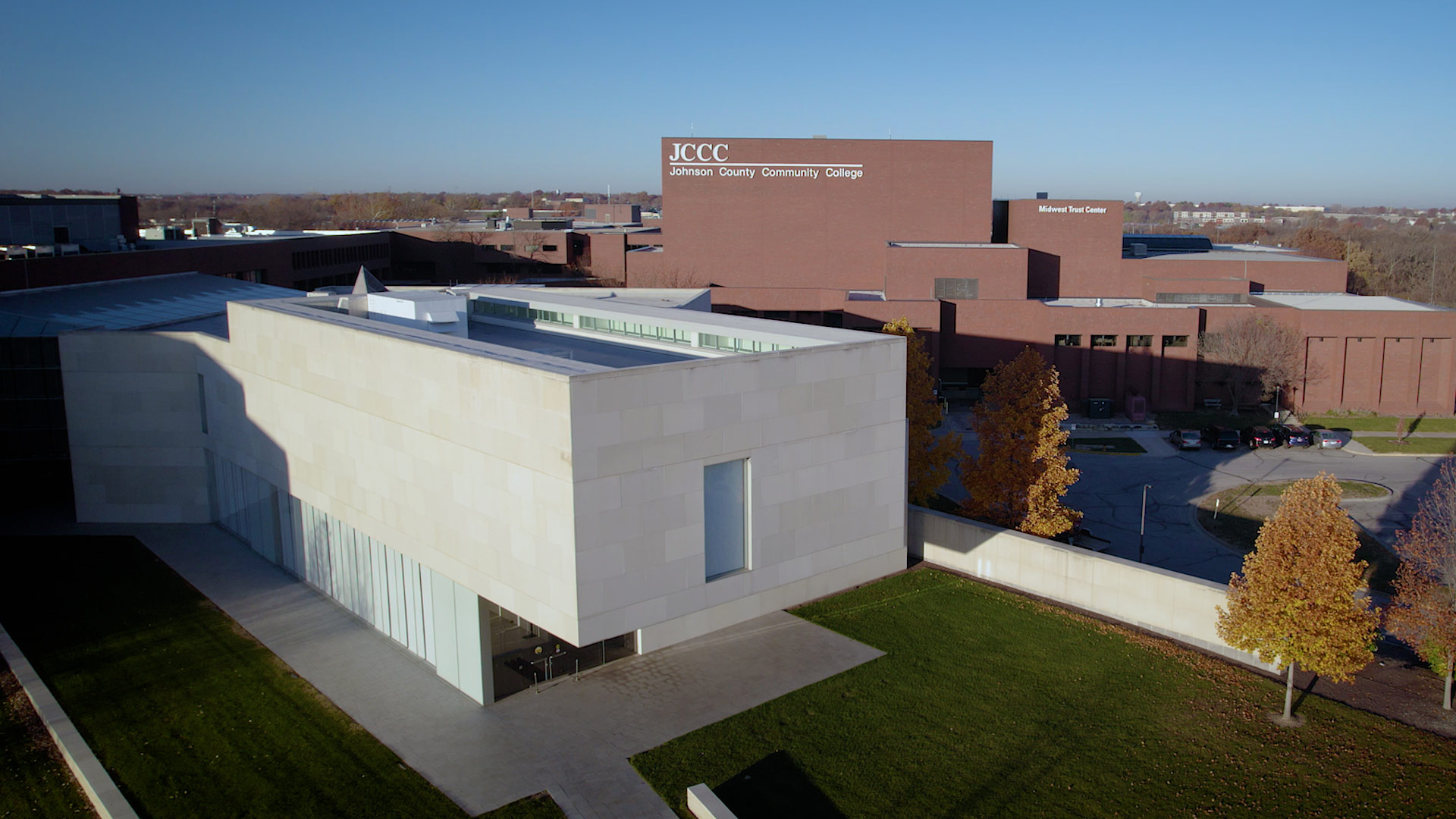 Drone shot of the front exterior of campus, highlighting buildings with Midwest Trust Center and Nerman Museum of Contemporary Art