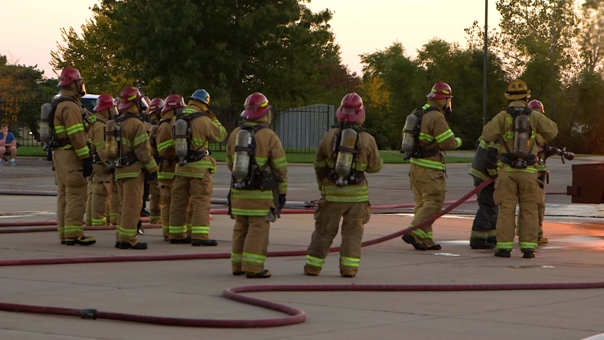 Firefighter students dousing a blaze