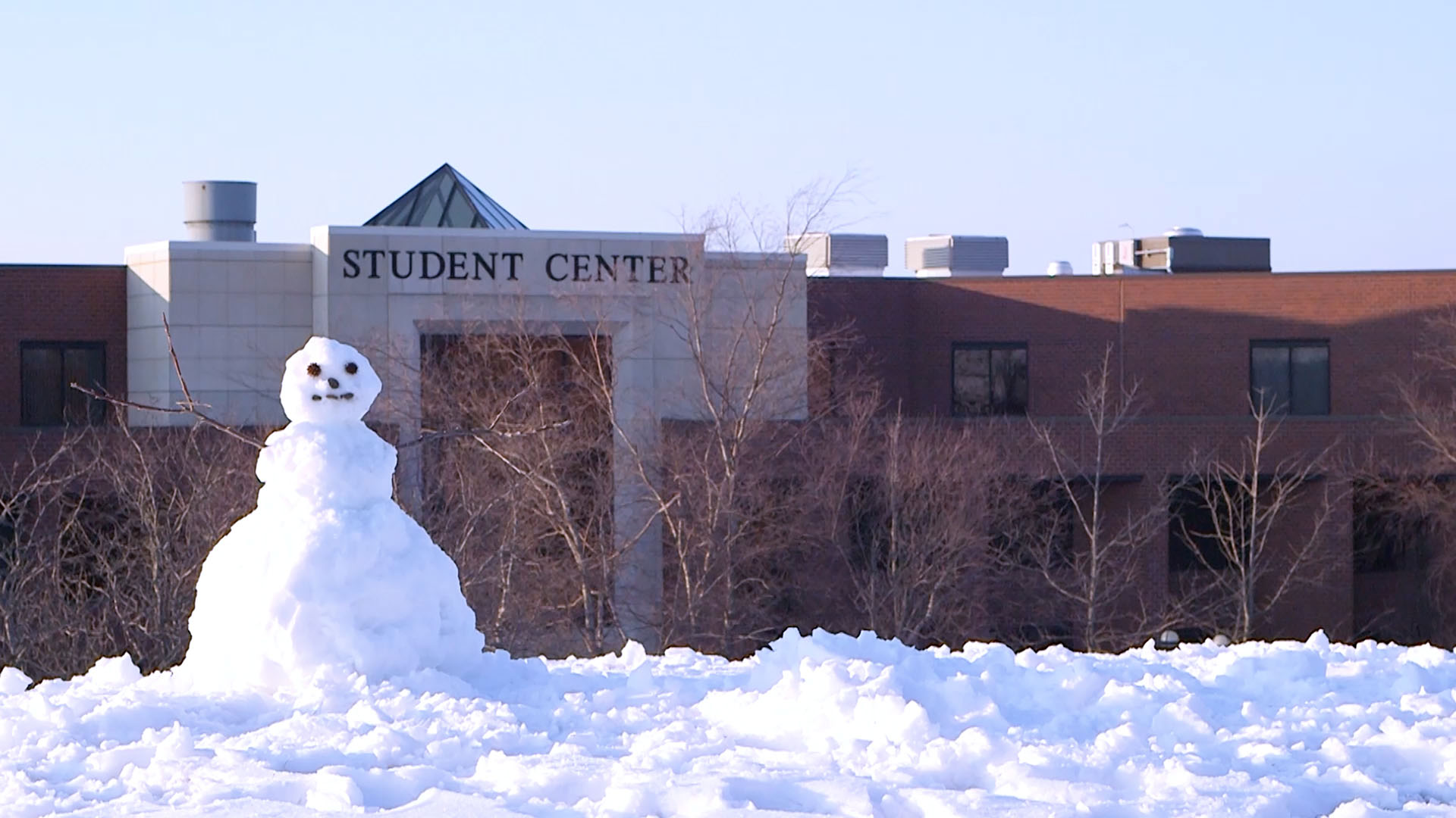 Snowman in the foreground, Student Center in the background